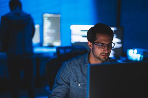 A software developer is thinking on improving the efficiency of the AI system. A software developer is thinking on improving the efficiency of the AI system.